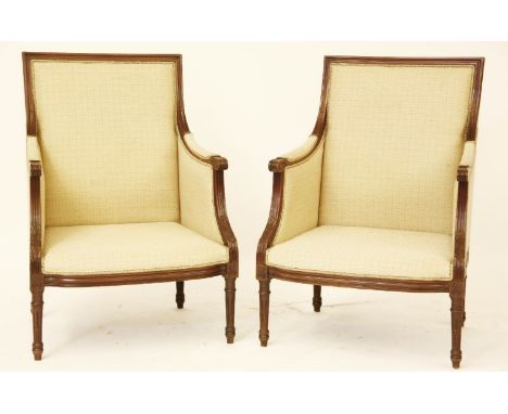 A pair of Regency style mahogany and yellow upholstered arm chairs, each approximately 66 x 53 x 95Provenance: from North Mym