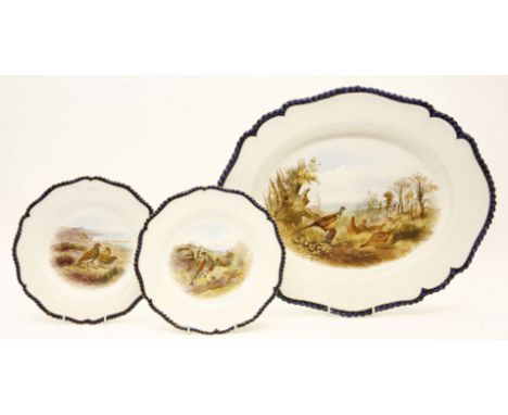 A Royal Worcester meat plate, and a pair of plates, decorated with hand painted centres, depicting partridges in a naturalist