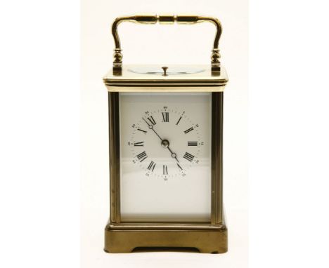 A mid to late 20th century French brass fire glass 'repeater' carriage clock, the white dial with black Roman and Arabic nume
