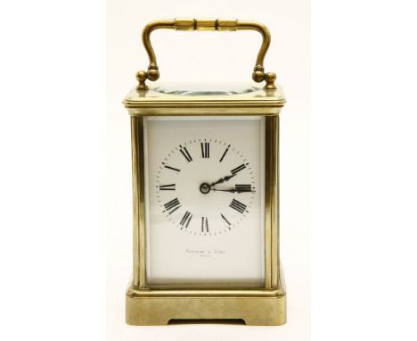 A French lacquered brass and fire glass carriage clock, the platform escapement over a white enamelled dial with black Roman 