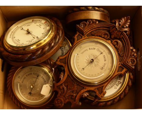 A Victorian oak cased aneroid barometer, by J Hicks, London, with rope twist and 7in dial, together with six further aneroid 
