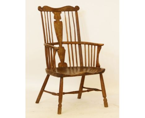 An early comb back Windsor chair, with splat back and elm seat