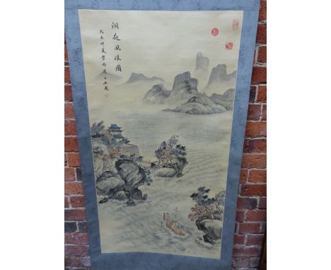 A CHINESE SCROLL PAINTING OF ISLANDS WITH A BOAT BEING POLED AWAY FROM ROCKS.   H 114.5 X W 62cms.