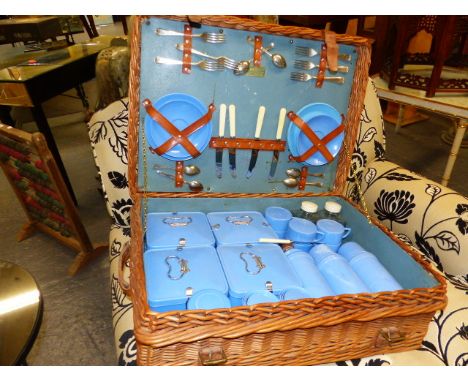A VINTAGE CORACLE WICKER PICNIC HAMPER WITH FITTINGS.