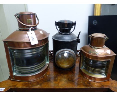 A VINTAGE RAILWAY SIGNAL LAMP TOGETHER WITH TWO COPPER SHIP'S LANTERNS.  (3)