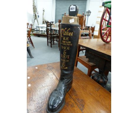 A VINTAGE LEATHER RIDING BOOT WITH HAND PAINTED ADVERTISING ELTHEA-R.E.TRICKER &amp; Co SHOE AND BOOT MAKER AND REPAIR.