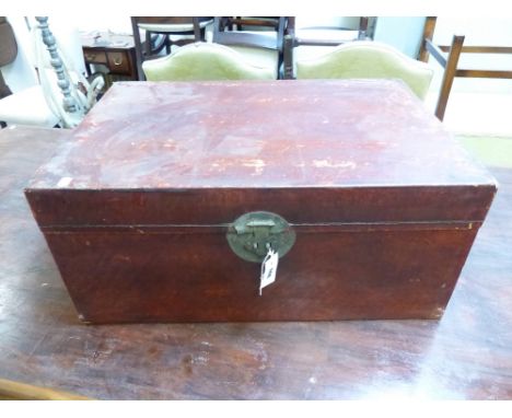 AN ORIENTAL VELLUM BOUND TRUNK WITH BRASS CARRYING HANDLES.   73 x 49 x H.33cms.
