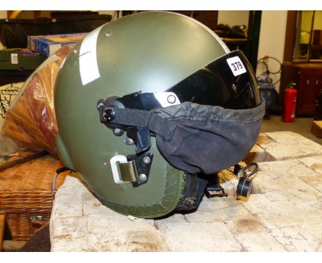 A MILITARY TYPE HELICOPTER PILOT'S HELMET WITH INTEGRAL HEADSET AND MICROPHONE.