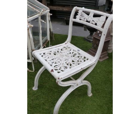 A SET OF FOUR VINTAGE CAST IRON GARDEN CHAIRS ON X-FORM BASES WITH FIST OF SIX ARROWS CREST RAILS.  (4)