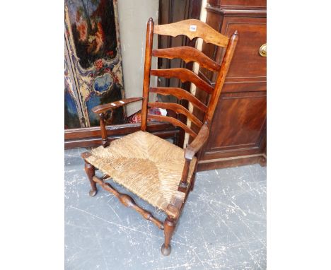 A 19th.C.ASH LADDER BACK COTTAGE ARMCHAIR WITH RUSH SEAT.