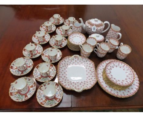 A SET OF TWELVE DERBY COFFEE CUPS AND SAUCERS TOGETHER WITH A SPODE TEN PLACE COFFEE SET PRINTED IN RED WITH FLEURS DE LYS.