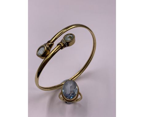 A 9ct GOLD GEMSET BANGLE TOGETHER WITH A 9ct GOLD GEMSET DRESS RING, FINGER SIZE  L,  GROSS WEIGHT 12.1grms. 