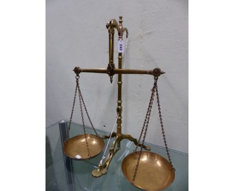 A SET OF DOYLE AND SONS, LONDON BRASS BALANCE SCALES, THE PANS RAISED ON THE TRIPOD STAND BY A PUSH BUTTON LEVER WITH LOCKING