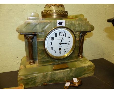 A GREEN ONYX CASED MOUGINS TIMEPIECE, THE ENAMEL DIAL BELOW A CUPOLA AND BETWEEN BRASS COLUMNS, INSCRIBED EXAMINED BY DENT, T