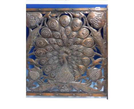 A COPPER PANEL PIERCED AND WORKED WITH A PEACOCK DISPLAYING, PREVIOUSLY ATTRIBUTED TO C R ASHBEE.   H 64 X 61cms.