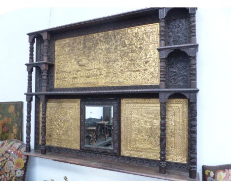 A THAI CARVED AND GILT WOOD THREE SHELF OVERMANTLE, THE THREE GILT RELIEFS OF DRAGON BOAT BURIAL CEREMONIES FLANKING A BEVELL