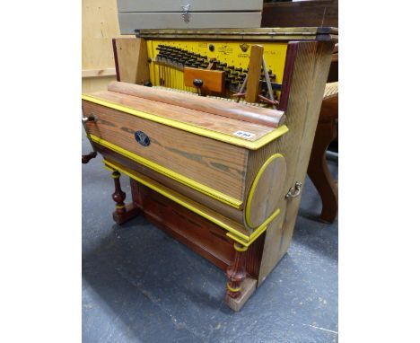 A VINTAGE BARREL PIANO ON WHEELED CART.  THE ORGAN BY VAVENTIA, BARCELONA WITH HAND CRANK ACTION AND TWO TUNE BARRELS.