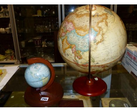 A REPLOGLE TWELVE INCH TERRESTIAL GLOBE TOGETHER WITH A 12cms DIAMETER ENGLISH GLOBE FOR THE FRENCH MARKET.