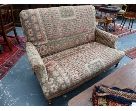 A VINTAGE VICTORIAN STYLE SETTEE WITH KELIM UPHOLSTERY ON TURNED FORELEGS.   W.154cms.