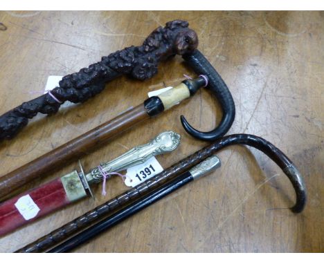 A RUSTIC WALKING STICK, ANOTHER WALKING STICK SILVER MOUNTED, BIRMINGHAM 1909, A ZERMATT WALKING STICK WITH CHAMOIS HORN HAND