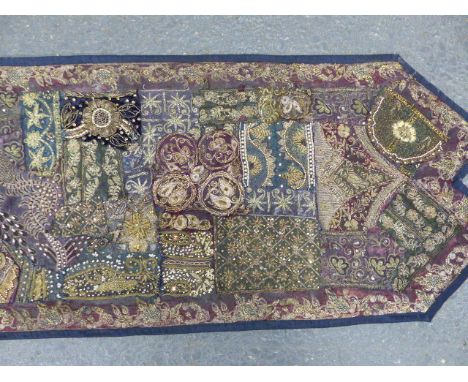 AN EASTERN EMBROIDERED METALLIC THREAD TABLE OR ALTAR RUNNER. 46 x 220cms.
