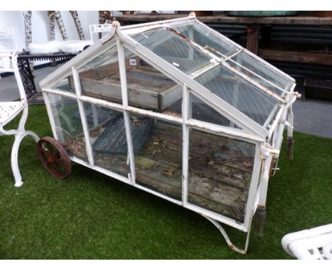 A RARE VINTAGE WHEELED GARDEN CLOCHE OR MINIATURE GREENHOUSE WITH RISING VENT TOP AND FOLDING BARROW HANDLES.   130 x 68 x H.