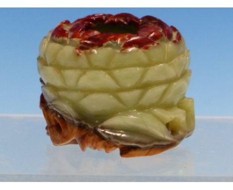 A CHINESE JADE LOTUS FLOWER BRUSH WASHER AND WOOD STAND, THE RIMS AND ENTWINED STEM FOOT BROWN, THE PETALS BETWEEN GREEN. Dia