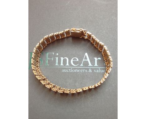 A 9ct YELLOW GOLD LADDER STYLE FLEXIBLE BRACELET COMPLETE WITH BOX CLASP AND TWO FIGURE OF EIGHT SAFETY CLASPS. WEIGHT 29.8gr