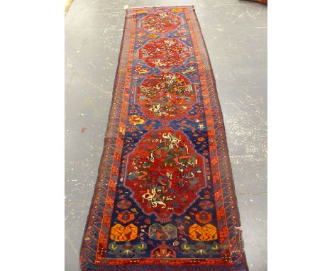 AN ANTIQUE CAUCASIAN KUBA RUNNER.   344 x 100cms.