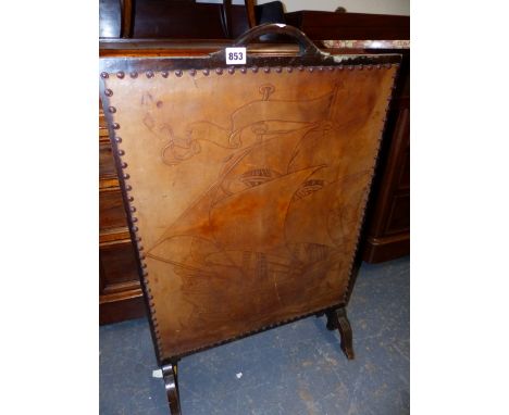 AN ARTS AND CRAFTS EMBOSSED LEATHER FIRESCREEN.   51 x 79cms.