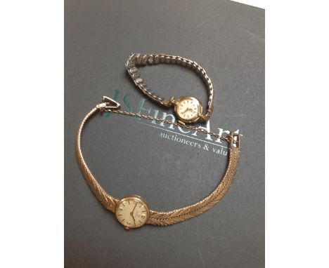 A 9ct GOLD LADIES OMEGA WATCH WITH A 9ct GOLD HERRINGBONE STYLE BRACELET , LADDER CLASP AND SAFETY CHAIN, DATED 1964, TOGETHE