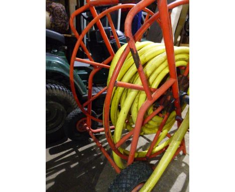 A MOUNTFIELD ROTARY MOWER. AND A HEAVY DUTY GARDEN HOSE ON REEL.