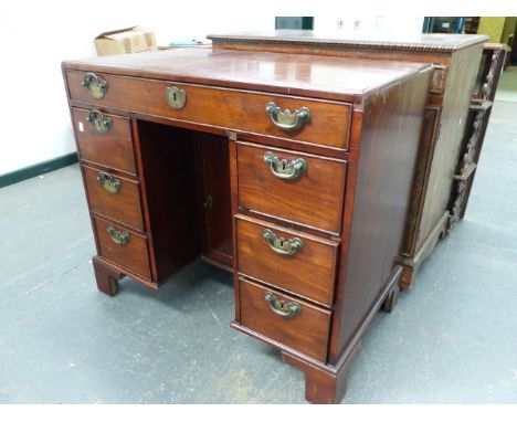 A GEO.III.MAHOGANY CADDY TOP KNEEHOLE DESK WITH CENTRAL CUPBOARD AND SEVEN DRAWERS ON BRACKET FEET.   87 x 51 x H.77cms.