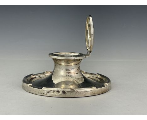 A large George V silver capstan inkwell, A J Zimmermann, Birmingham 1920, circular wide splayed form with crenelated outer ri