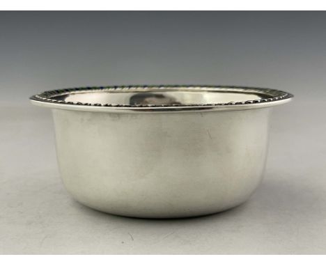 Liberty and Co, an Arts and Crafts silver and enamelled bowl, Birmingham 1910, rounded form, the rim with blue and green enam