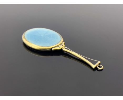 An Austrian silver gilt and enamelled pendant hand mirror, circa 1910, oval with blue guilloche back and black enamel handle,