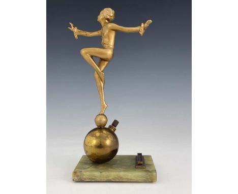 Josef Lorenzl, an Art Deco gilt art metal figural table lighter, circa 1925, modelled as a dancing woman balancing on a ball,