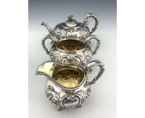 A Victorian silver three piece tea set, A B Savory and Sons, London 1863, including teapot, sugar bowl and jug, squat ovoid f