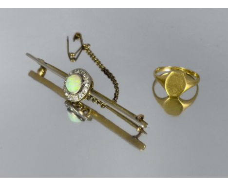 A diamond and opal cluster bar brooch, in gold and platinum, together with an 18 carat gold signet ring, 6cm long (2)