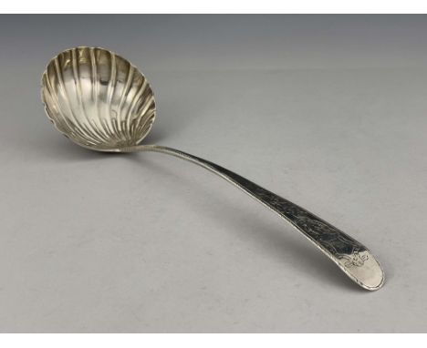 A George III Irish silver soup ladle, Michael Keating, Dublin 1772, Feather Edged pattern, engraved with Rococo cartouche and