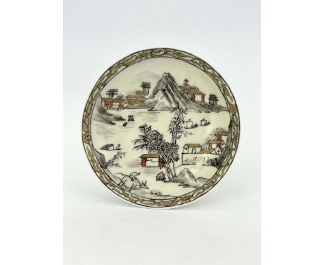 A Worcester black and red pencilled and gilded saucer, circa 1760, decorated with a watery Chinese landscape of mountains, te