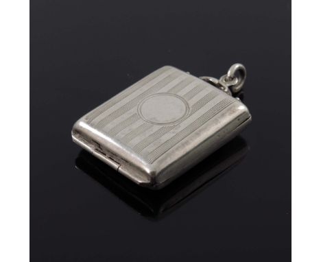 A George V silver Stamp case, Birmingham 1912, engine turned striped design, with foliate catch and fob attachment