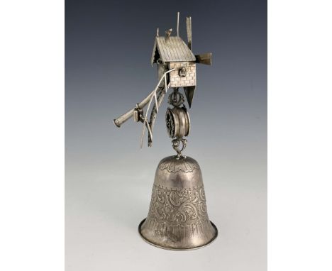 A Dutch silver Windmill cup/wager cup, 1898, bell shaped repousse cup, with open-worked stem and pitched roof mill with novel