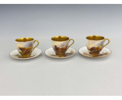 Harry Stinton for Royal Worcester, a set of three Highland cattle painted cups and saucers, gilt interior, 1924, signed, puce