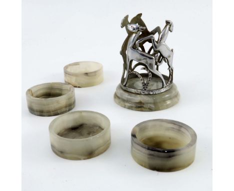 An Art Deco Austrian chrome and onyx coaster set, housed in stand with leaping deer on onyx plinth, signed R Fels, stamped AN