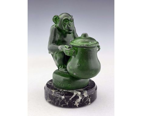Max Le Verrier, an Art Deco patinated art metal Monkey inkwell, circa 1925, modelled sitting, holding a lidded pot, on circul