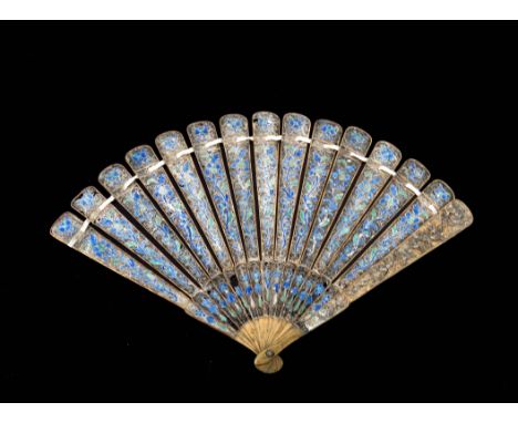 A Chinese gilt filigree and enamelled brise fan, 19th century, the guards with applied floral decoration in silver, the stick