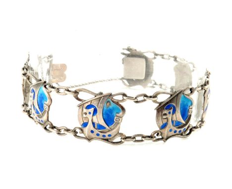 Murrle Bennett and Co., an Arts and Crafts silver and enamelled bracelet, the seven panel links cast with stylised Viking shi
