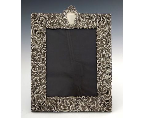 A Victorian silver photograph frame, Charles Dumenil, London 1899, rectangular, embossed in relief with knotted foliate scrol