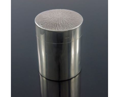 A Modernist silver tea caddy, Neil Lovesey, London 1972, cylindrical form with textured bark effect lid, 9.5cm high, 8.62ozt
